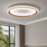 Ceiling light fixture in a room with a window and curtains